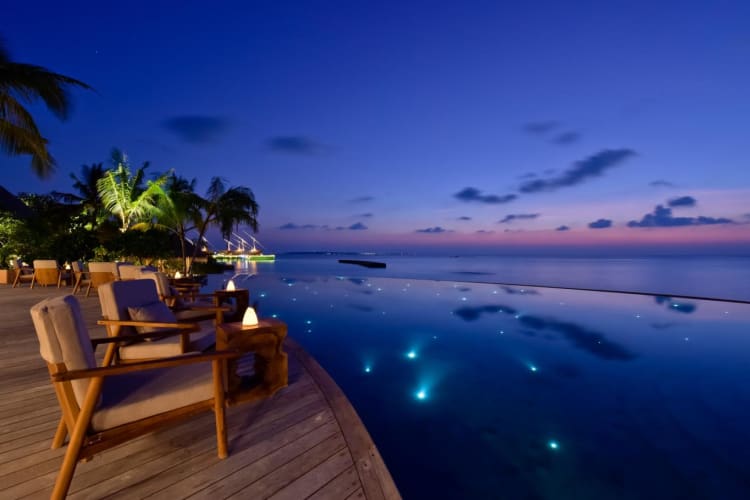 Compass pool bar terrace by night